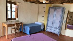 En eller flere senge i et værelse på Albergo diffuso Ecobelmonte