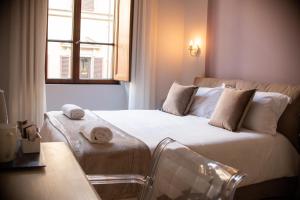 Posteľ alebo postele v izbe v ubytovaní B&B Dimora Sassetti 6