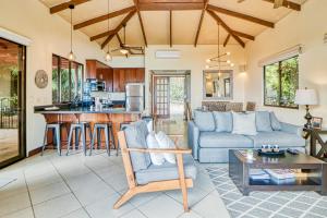 a living room with a couch and a table at Canto del Mar #20 in Dominical