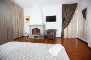Agriturismo Villa Paradiso Esotico客房内的一张或多张床位