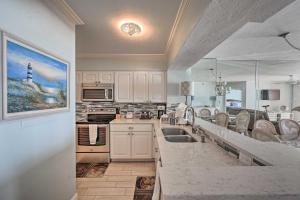 a kitchen with a sink and a counter top at Oceanfront Marco Island Escape with Beach Access! in Marco Island