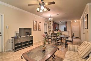 a living room with a couch and a table at Davenport Condo with Pool Access - 11 Mi to Disney! in Davenport