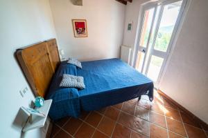 Postel nebo postele na pokoji v ubytování Casa Rossa Lacona
