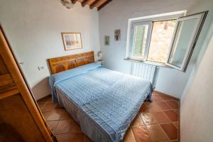 Postel nebo postele na pokoji v ubytování Casa Rossa Lacona