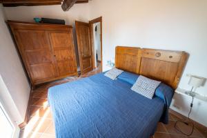 Postel nebo postele na pokoji v ubytování Casa Rossa Lacona