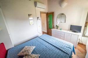 TV a/nebo společenská místnost v ubytování Casa Rossa Lacona
