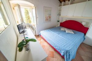 Postel nebo postele na pokoji v ubytování Casa Rossa Lacona