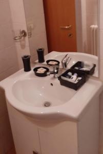 a white sink in a bathroom with a mirror at Ascoli per te in Ascoli Piceno