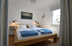 Posteľ alebo postele v izbe v ubytovaní Frauscher Hafen-Apartments