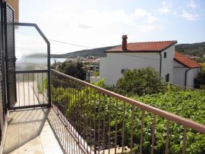 a balcony with a view of a house at Apartment Anton in Slatine +9 photos