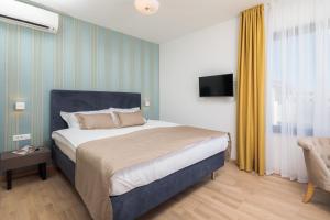 Posteľ alebo postele v izbe v ubytovaní Villa Four Brothers - Penthouse Suite
