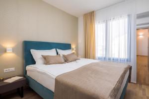 Posteľ alebo postele v izbe v ubytovaní Villa Four Brothers - Penthouse Suite