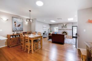 a kitchen and living room with a table and chairs at Colonia Verde in Tucson