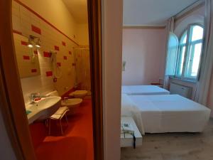 Postel nebo postele na pokoji v ubytování Elba Hotel