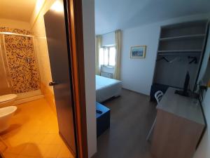 Postel nebo postele na pokoji v ubytování Elba Hotel