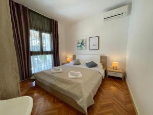 Tempat tidur dalam kamar di Apartments Nona