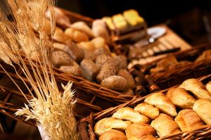 
a basket filled with lots of different types of bread at pentahotel Rostock in Rostock
