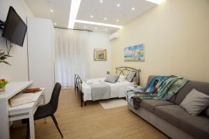 TV a/nebo společenská místnost v ubytování PONTE VALLE B&B POMPEI