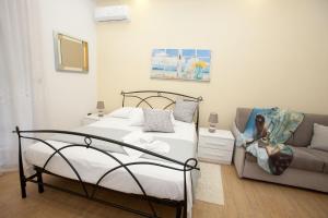 Ένα ή περισσότερα κρεβάτια σε δωμάτιο στο PONTE VALLE B&B POMPEI