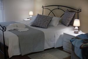 Postel nebo postele na pokoji v ubytování PONTE VALLE B&B POMPEI