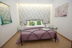 Postel nebo postele na pokoji v ubytování PONTE VALLE B&B POMPEI