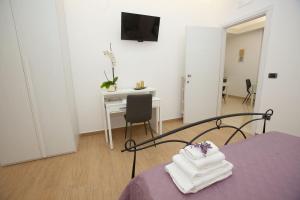 Postel nebo postele na pokoji v ubytování PONTE VALLE B&B POMPEI