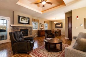 a living room with furniture and a fireplace at Two Bedroom Villa in the Heart of Branson! in Branson