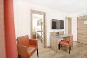 TV a/nebo společenská místnost v ubytování Hotel Alpina Superior