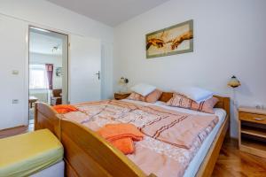 Posteľ alebo postele v izbe v ubytovaní Apartments Villa 7