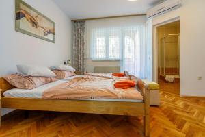 Posteľ alebo postele v izbe v ubytovaní Apartments Villa 7
