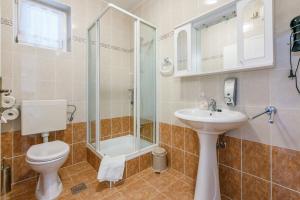 Kúpeľňa v ubytovaní Apartments Villa 7