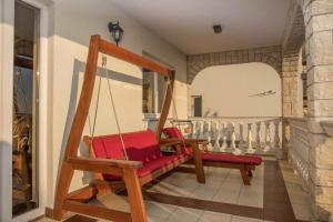 a room with a swing in a house at Apartments RUZA in Crikvenica