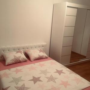 a bedroom with a bed and a mirror at Trebinje Mirjana in Trebinje