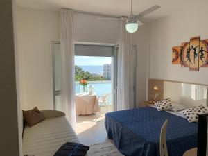 Postel nebo postele na pokoji v ubytování Hotel Sahara