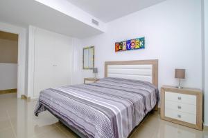 Ένα ή περισσότερα κρεβάτια σε δωμάτιο στο Flamenco beach house +40 φωτογραφίες