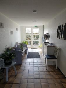 Posezení v ubytování Hotel Garni Haus Dithmarschen