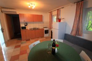 Kuchyň nebo kuchyňský kout v ubytování Apartments Tajci