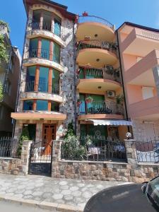 a building with balconies on the side of it at Moreno in Sozopol