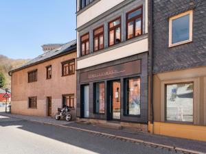 a building with a motorcycle parked in front of it at Stylish apartment with terrace in Sonneberg in Sonneberg