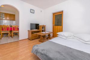 Postel nebo postele na pokoji v ubytování Apartments IvaT