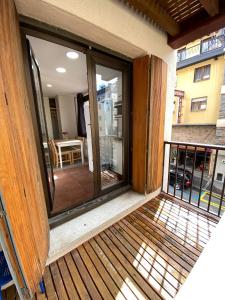 a balcony with sliding glass doors on a building at Nevada 2 409 HUT2-5929 in Pas de la Casa