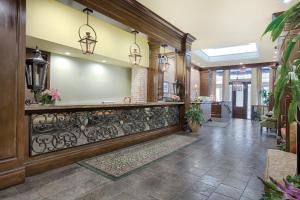 a lobby with a reception desk in a building at Club Wyndham La Belle Maison in New Orleans