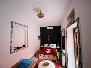Postel nebo postele na pokoji v ubytování Riad Naya