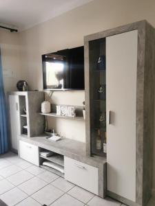 a bathroom with a sink and a mirror at Rocas del Mar Apartment in Costa Del Silencio