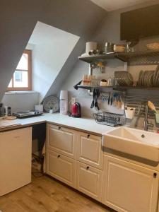 a kitchen with a sink and a counter top at Apartmán pod Starým zámkom in Banská Štiavnica