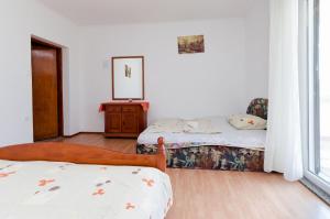 Postel nebo postele na pokoji v ubytování Apartments Danica