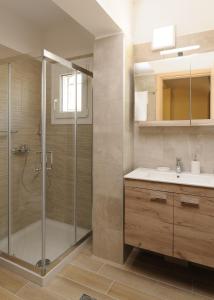 a bathroom with a shower and a sink at Stella Maris - Sivota Holiday Home in Sivota