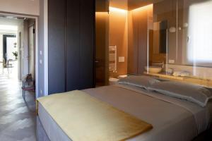 Postel nebo postele na pokoji v ubytování RICCIONE SUITE DESIGN
