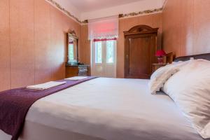 Postel nebo postele na pokoji v ubytování Villa Drago