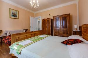 Postel nebo postele na pokoji v ubytování Villa Drago